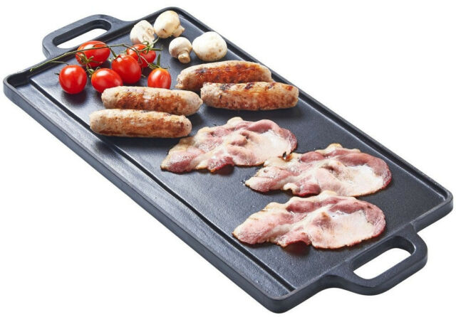 This is a picture of a cast iron griddle hotplate using the smooth side and cooking sausages and bacon